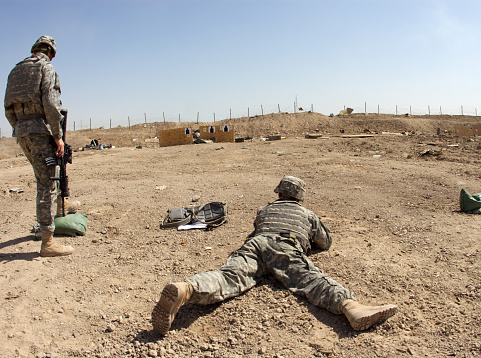 Soldier firing M-4 Carbine in Ramadi, Iraq. Semi-Fisheye effect. 