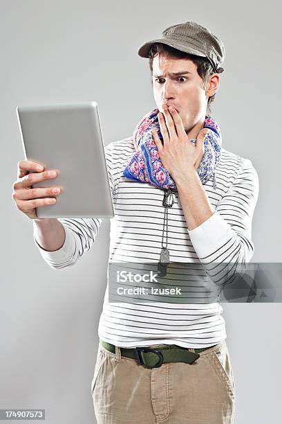 Young Man Using Digital Tablet Stock Photo - Download Image Now - 20-24 Years, Abundance, Adult