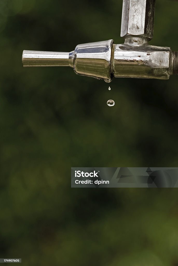 Every drop A droplet of water escaping from the handle of a water fountain. Care Stock Photo