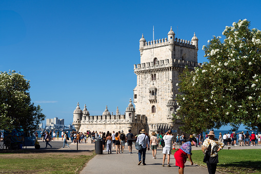 Lisbon, Portugal- Aug 14, 2023: Tourists visiting the historic Belém Tower in Lisbon, Portugal