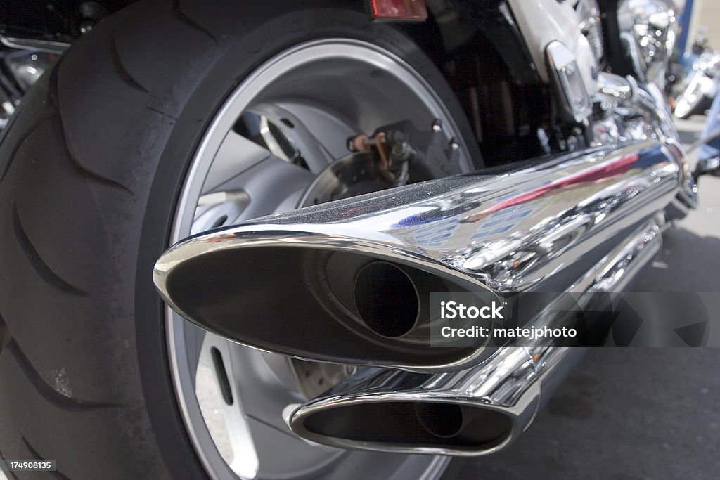 Motorcycle Exhaust Detail of a motorcycle exhaust shot from low vantage point Motorcycle Stock Photo