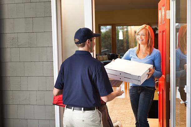 istock Pizza Delivery Man with Take-out Package at Customer's Door Hz 174908415