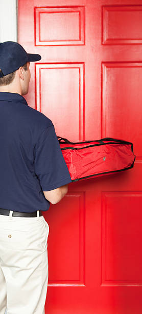 istock Pizza Delivery Man Delivering Take-out Package to Customer's Home Vt 174908793