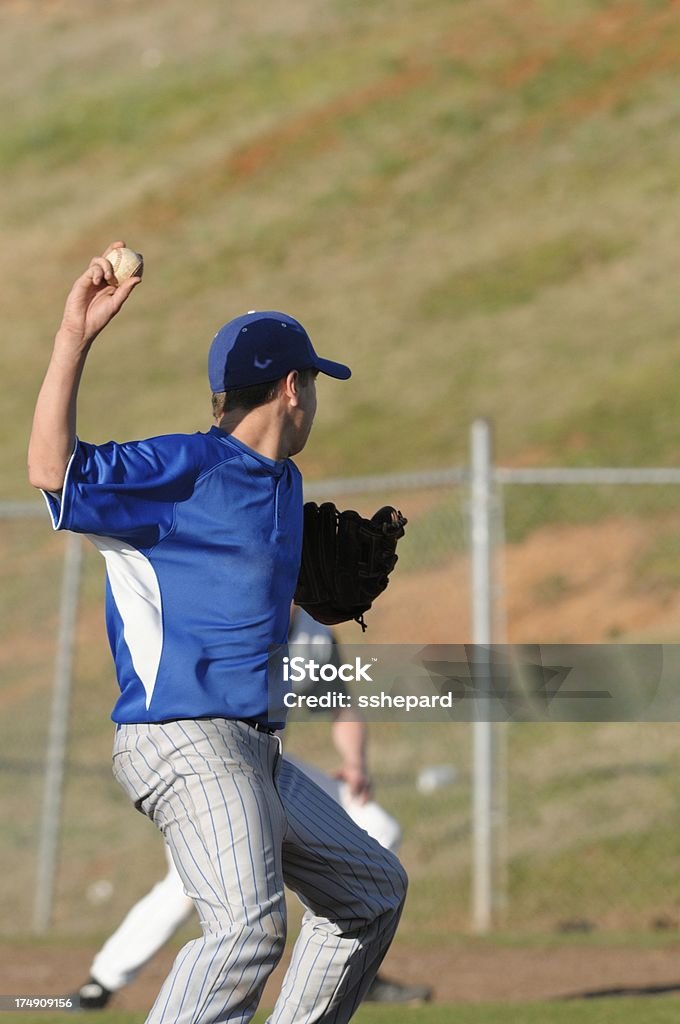 Pitcher Throwing To First Stock Photo Download Image Now Adult
