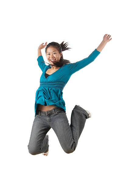 young chinese women jumping stock photo