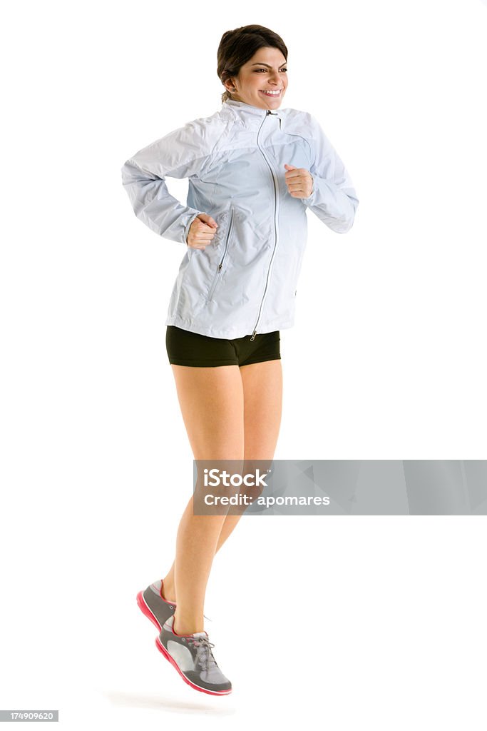 Young happy woman jogging in studio on white background Young happy woman jogging in studio on white background. Image with clipping path. Jogging Stock Photo