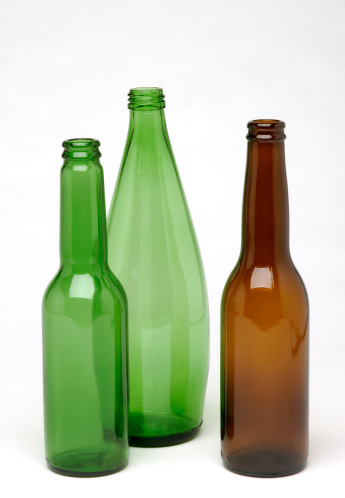 Three green and brown glass bottles to recycle.Related images:[/b]