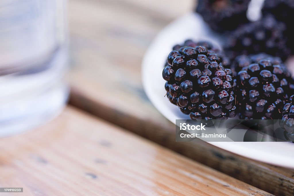 blackberries close-up of blackberries on a plate Blackberry - Fruit Stock Photo
