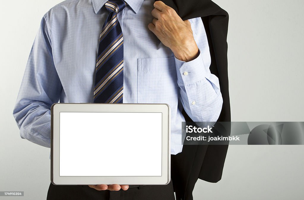 Empresario con brida agarrando una tableta digital - Foto de stock de Agarrar libre de derechos