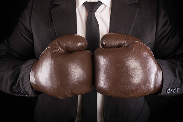 istock businessman with boxing gloves 174911612
