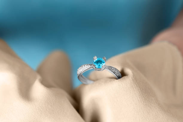 istock Jeweler cleaning topaz ring with microfiber cloth, closeup 1749118103