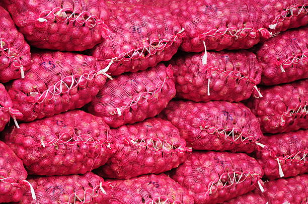 Dambulla,Sri Lanka. Telephoto image of stacked onions at the central Dambulla corporation. dambulla stock pictures, royalty-free photos & images