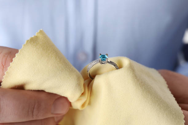 istock Jeweler cleaning topaz ring with microfiber cloth, closeup 1749119161