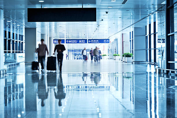 istock People Rushing through a Airport 174912083