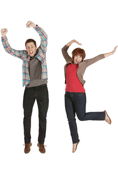 istock Excited young couple jumping 174912399
