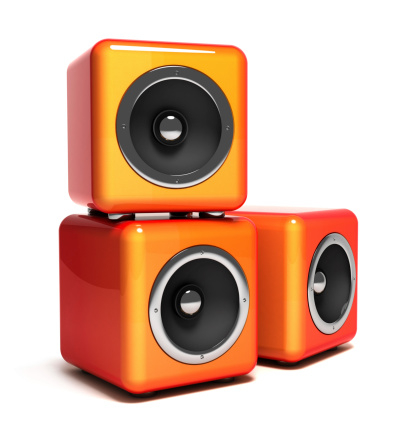 Orange audio speakers isolated on white