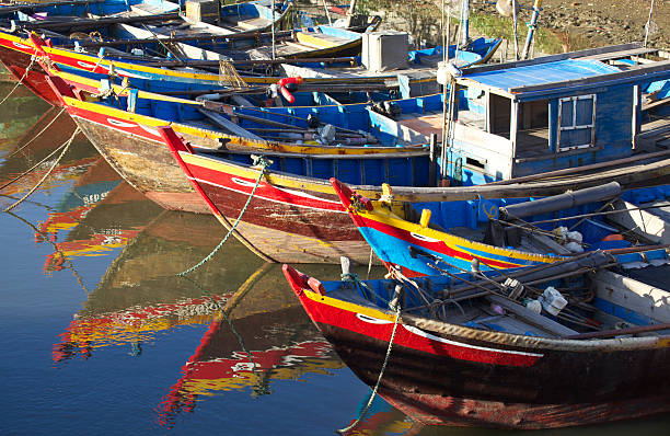 Fishing boats Many fishing boats line the shore of a village near Mui Ne in Vietnam South East Asia. Morning light. mui ne bay photos stock pictures, royalty-free photos & images