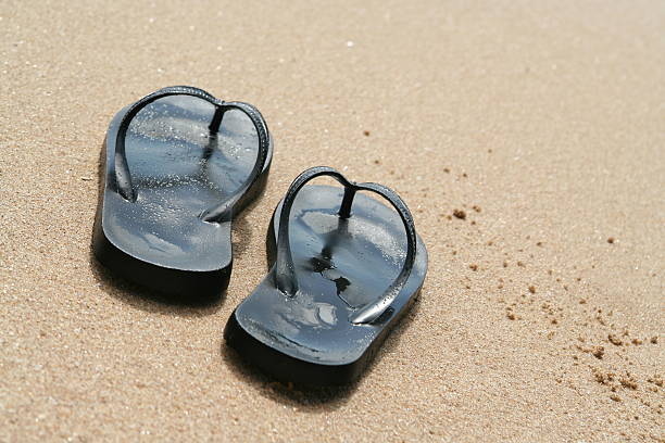 istock Flip flop on the beach 174913221