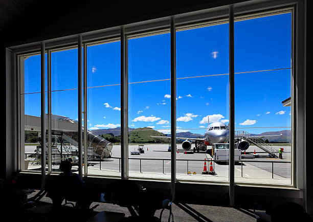 An aircraft arriving at Wellington International Airport, New Zealand, on an overcast cloudy day.