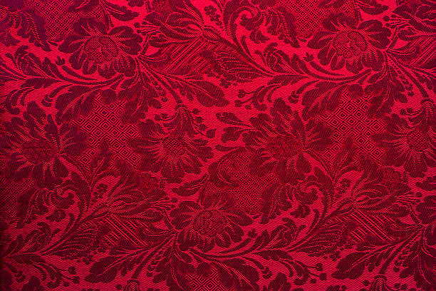 Dark red textile wallpaper on the wall stock photo