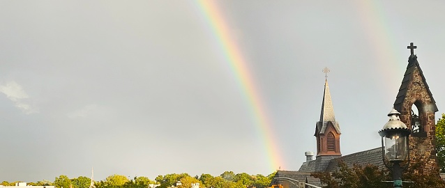 Double rainbow over suburban downtown