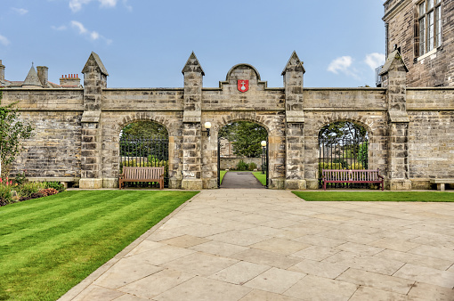 St Andrews, Scotland - September 22, 2023: The iconic buildings and grass fields of the quadrangle at the University of St Andrews in Scotland
