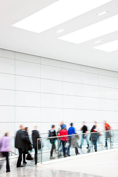 istock Large Group of People Walking Indoors, Blurred Motion 174913521