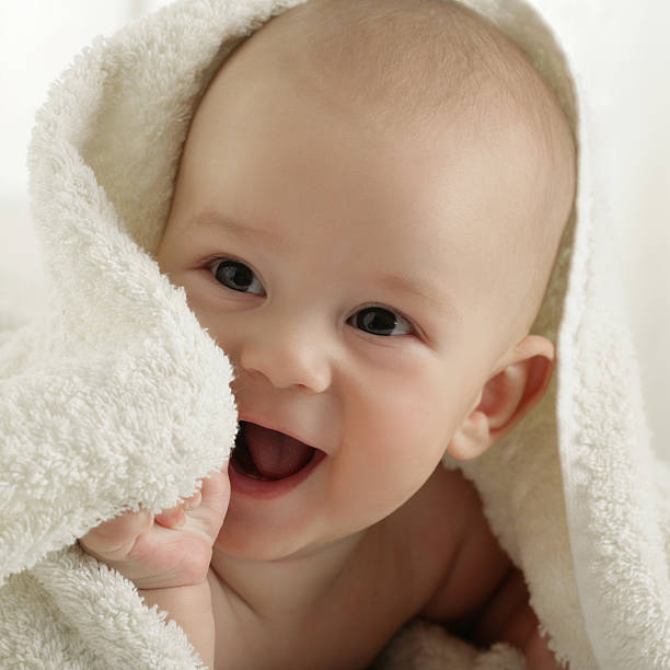 Happy Baby Boy After Bath stock photo