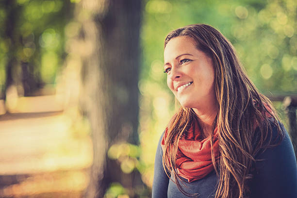 istock Woman in autumn parkway 174914058