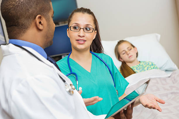 istock Nurse explaining discussing patient with doctor in hospital room 174914228