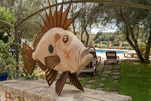 Felanitx, Spain; october 06 2023: Son Menut agrotourism and riding school, in the Majorcan town of Felanitx, Spain. Metal sculpture of a fish
