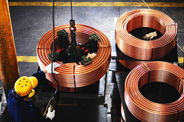Overview of worker testing copper coils Copper coils amalgam stock pictures, royalty-free photos & images