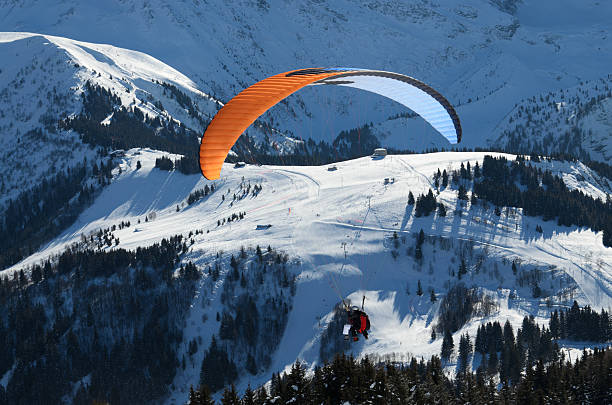 istock Parachuter above the snowy mountains 174915280