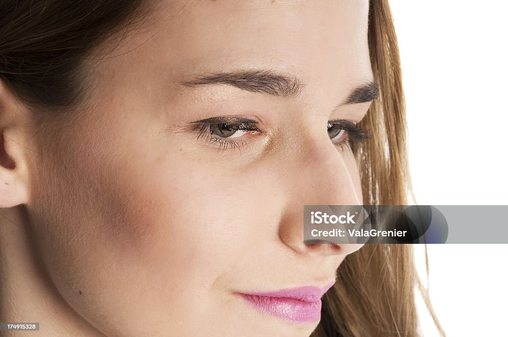 Semi-profile closeup of young woman's face Horizontal studio shot on white of young woman's face in sem-profile. 16-17 Years Stock Photo