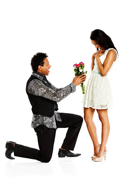 istock Loving man offering woman flowers 174915962