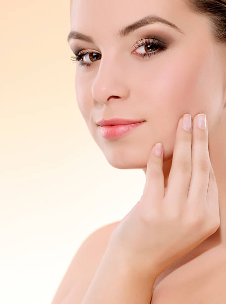 istock woman touching skin 174916338