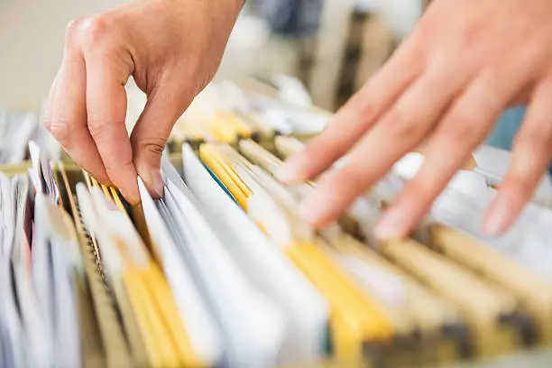 Photo of Searching In File Cabinet