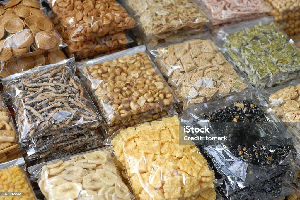 Asian Snacks The photo shows snacks packed in clear plastic on an Asian market. Bag Stock Photo