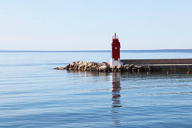 istock blue mediterranean ocean with beacon in Krk harbour Croatia 174917452