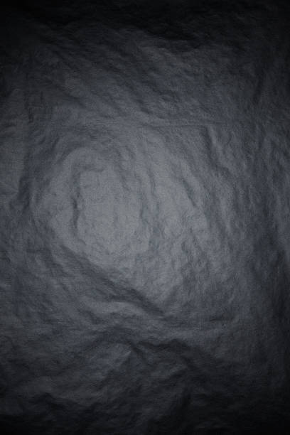 istock Black rice paper texture background with spotlight 174917684