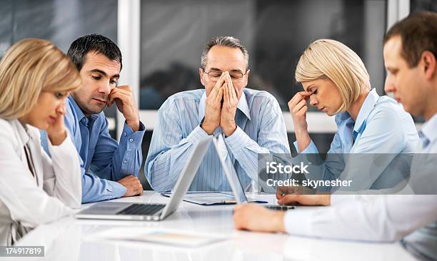 Businesspeople Expressing Stress At Work Stock Photo - Download Image Now - Business Person, Group Of People, Tired