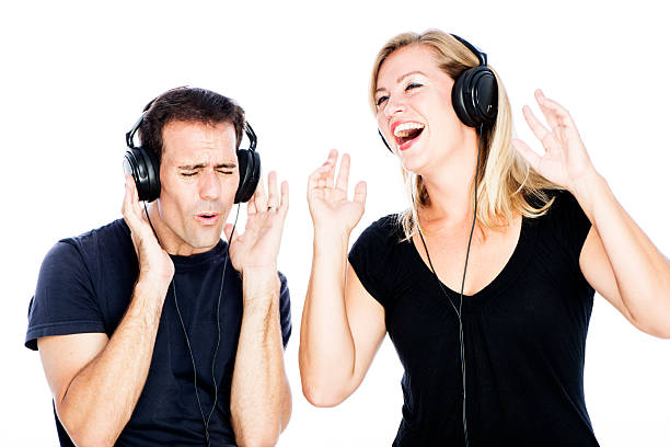 Couple Wearing Headphones Dancing