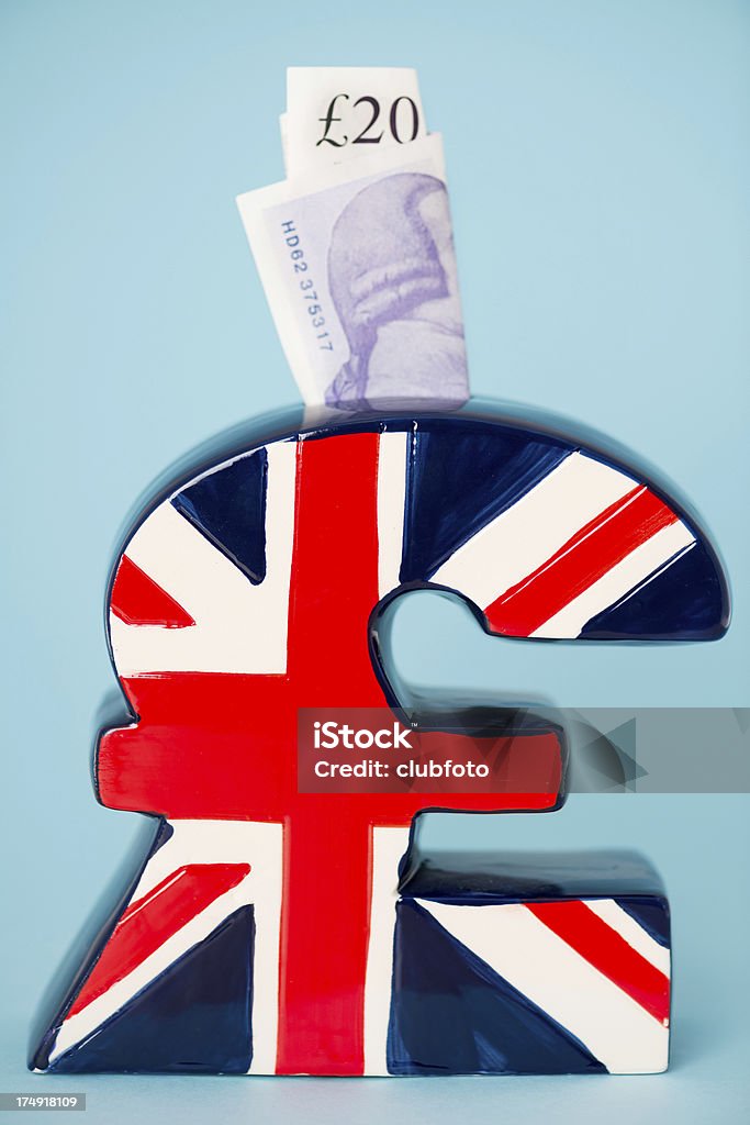 英国ポンド記号ピギー銀行 - 20ポンド紙幣のロイヤリティフリーストックフォト