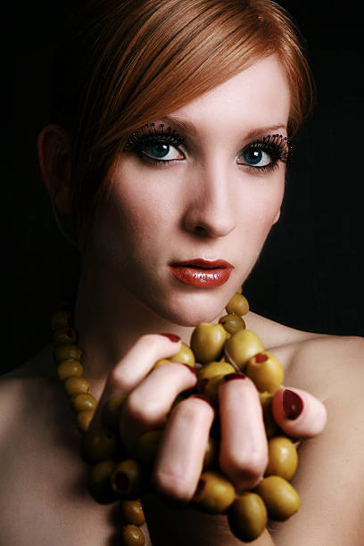 Olive Portrait young woman (twenty-one) with olives modelce stock pictures, royalty-free photos & images