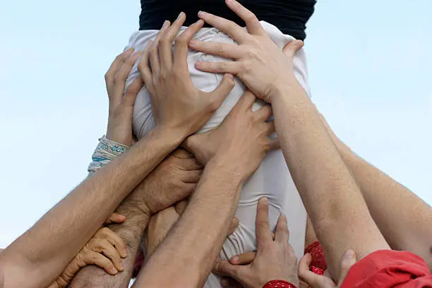 Castellers is a traditional festivity in Catalonia (Spain) when people work together building human castles.