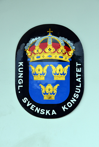 Paramaribo, Suriname: enamel sign of the Royal Consulate of Sweden - Swedish coat of arms - Blazon: Azure, with three coronets Or, ordered two above one. Crowned with a royal crown.