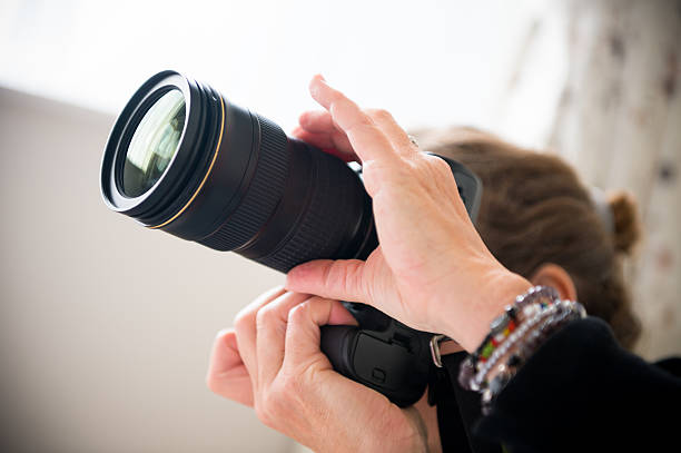 istock Photographer holding professional camera 174919547