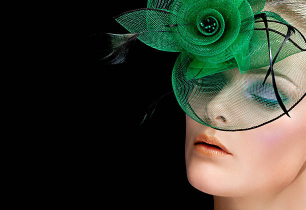 istock woman with multicolored make-up wearing green hat 174919591
