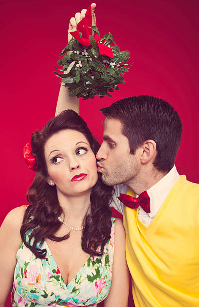 istock Man and Woman with Mistletoe 174919965