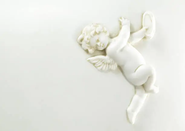 Photo of Porcelain Cherub Playing the Tambourine